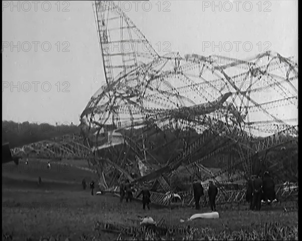 The Burnt Remains of the R-101 Airship Lying on the Ground After Fire and Destruction, 1930. Creator: British Pathe Ltd.