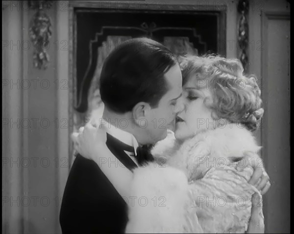 Scene from the Film 'Champagne': The Actress Betty Balfour Embracing the Male Actor Jean..., 1920s. Creator: British Pathe Ltd.