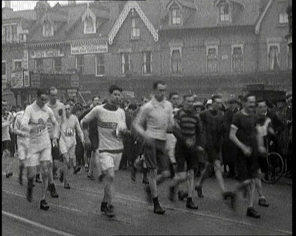 Crowds Watching a Men's Walking Race in the Street, 1920. Creator: British Pathe Ltd.