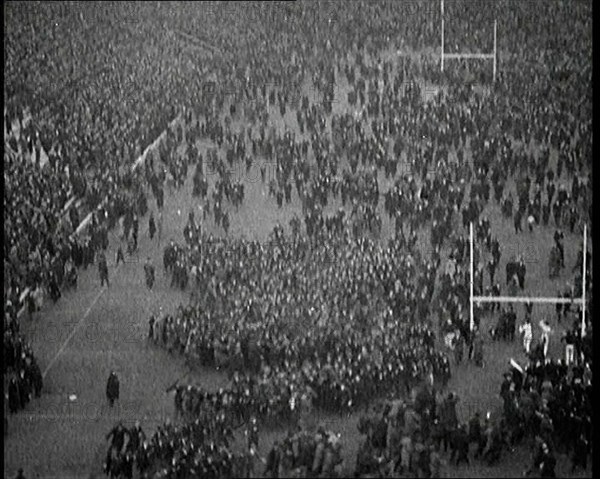 People Crowding the Pitch After an American Football Game, 1922. Creator: British Pathe Ltd.