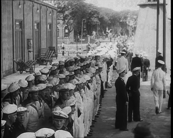 Male German Navy Crew Lined up in Front of a Building in Montevideo, 1939. Creator: British Pathe Ltd.