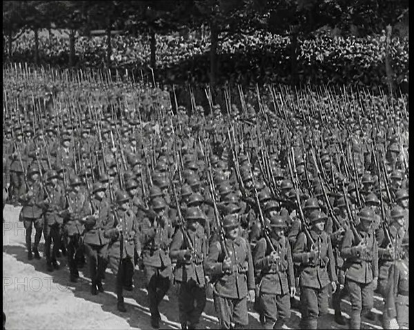 Lines of Male French Soldiers Marching Down the Champs Elysees During a Bastille Day..., 1939. Creator: British Pathe Ltd.