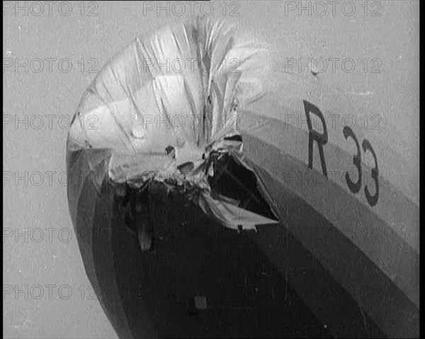 Front View of the 'R.33' Zeppelin With a Dented and Damaged Nose After Flying Through a Storm, 1924. Creator: British Pathe Ltd.