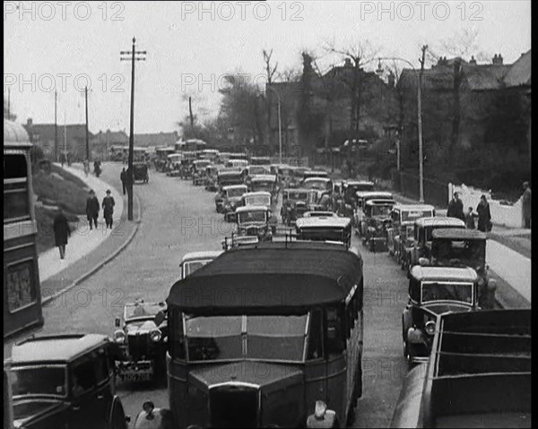 Cars Driving Down a Road Towards the Camera, 1930s. Creator: British Pathe Ltd.