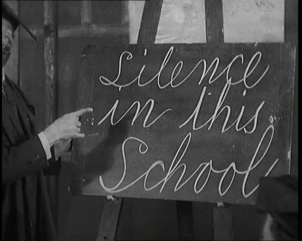 The Entertainer Will Hay Writing on a Blackboard, 1920s Creator: British Pathe Ltd.