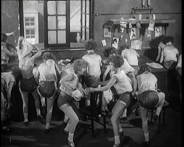 Female Actors Rapidly Changing Costumes For the Next Scene Backstage at the Theatre, 1920s. Creator: British Pathe Ltd.