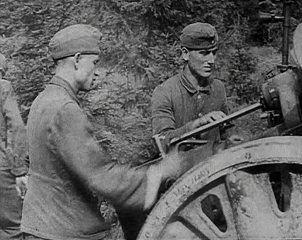 German Soldiers Operating an Artillery Gun, 1941. Creator: British Pathe Ltd.