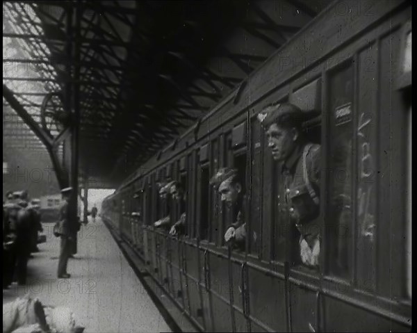 Male Members of the British Expeditionary Force Leaning Out of the Carriages as a Train is..., 1939. Creator: British Pathe Ltd.