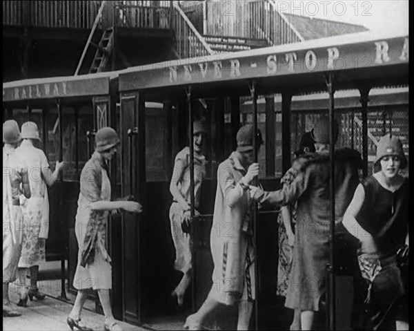 A Group of Female Civilians Board a Carriage of the 'Never Stop Railway', 1924. Creator: British Pathe Ltd.