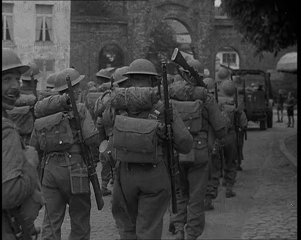 British Soldiers Marching Through a French Town, 1940. Creator: British Pathe Ltd.