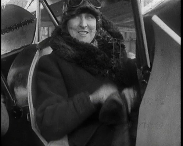 Female Civilian Wearing an Aviator's Hat Onboard of an Airplane, 1927. Creator: British Pathe Ltd.