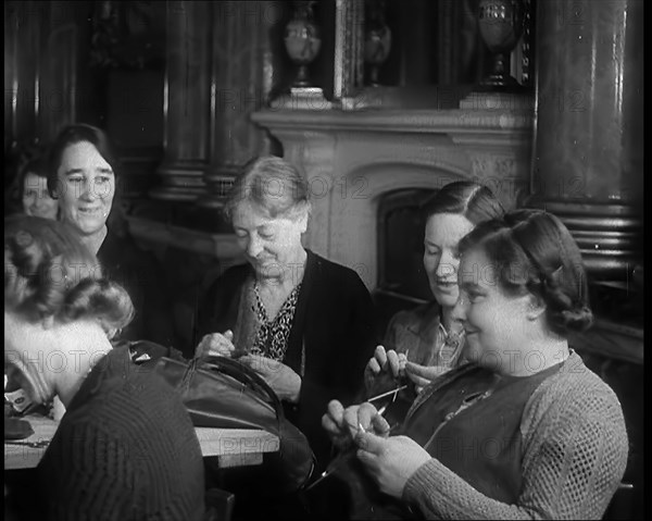 Buckingham Palace Hosting a Sewing Group. Large Numbers of Women Sewing or Knitting, 1940. Creator: British Pathe Ltd.