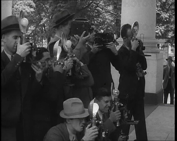 Photographers Photographing Henry Ford Arriving at the White House, 1930s. Creator: British Pathe Ltd.