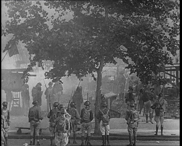 U.S Army Soldiers Confronting Protesting Soldiers With Tear Gas and Bayonets To Disperse..., 1932. Creator: British Pathe Ltd.