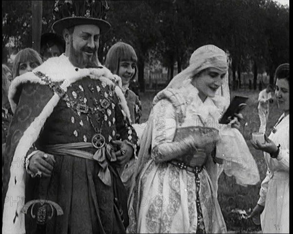 The Actor Henny Porten Dressed in Period Costume Putting on Make up from a Powder Compact..., 1920s. Creator: British Pathe Ltd.