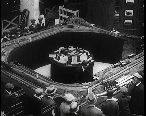 A Group of Male Children Looking at an Exhibit of a Model Railway at the British Empire..., 1924. Creator: British Pathe Ltd.