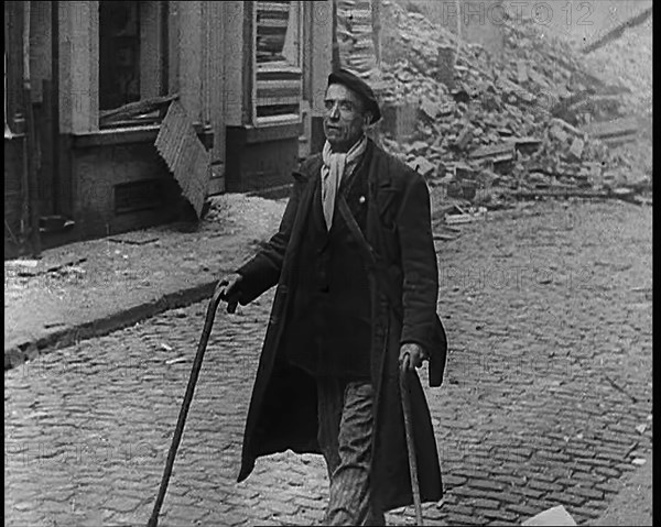 French Refugee Walking Through Demolished Town, 1940. Creator: British Pathe Ltd.