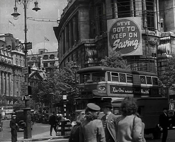 People and Traffic Moving Around a City, 1941. Creator: British Pathe Ltd.