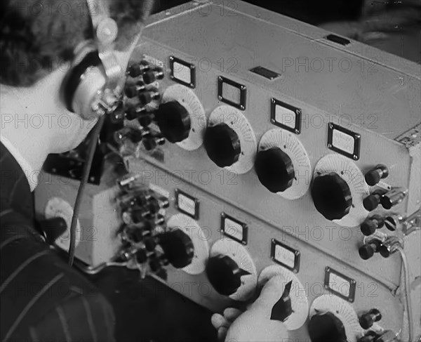 A Man Operating a Radio, 1940. Creator: British Pathe Ltd.