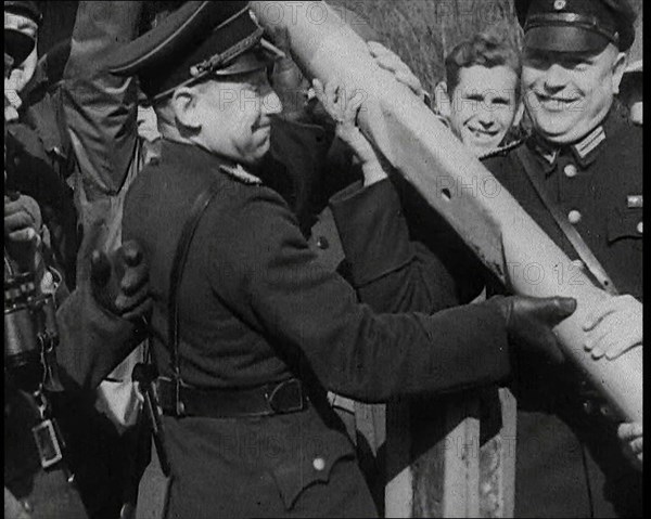 Male German Officers Removing a Barrier at a Checkpoint on the Border Between Germany and..., 1938. Creator: British Pathe Ltd.