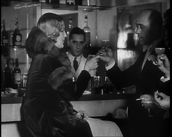 A Man and a Woman Drinking at a Nightclub, 1930s. Creator: British Pathe Ltd.