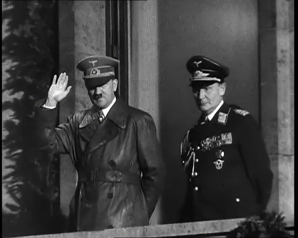 Adolf Hitler, the German Leader, Saluting the Crowd with Hermann Goering on the...,1937 Creator: British Pathe Ltd.