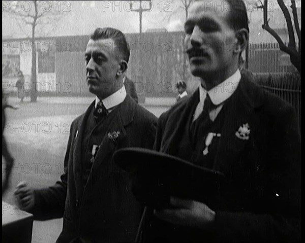 Male Ex-Services Civilians Playing a Hurdy-Gurdy For Money in the Street, 1920s. Creator: British Pathe Ltd.