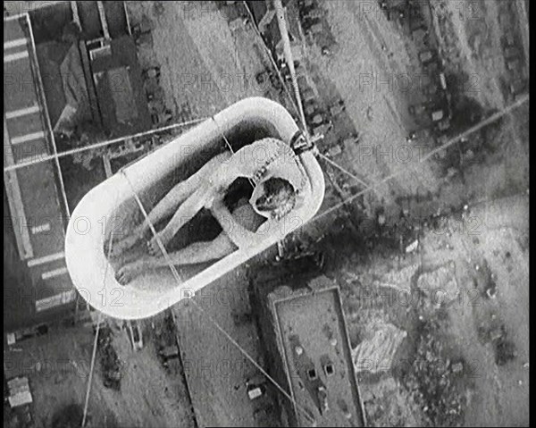 A Male Civilian Sitting in a Bath Lifted Off the Ground By a Hot Air..., 1920s. Creator: British Pathe Ltd.