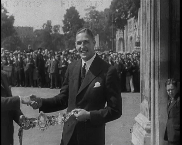 Boxer, Jack Petersen Accepting a Boxing Award Belt, 1930s. Creator: British Pathe Ltd.