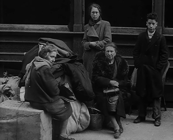 Civilians Surrounded by Bombed Out Buildings, 1940. Creator: British Pathe Ltd.