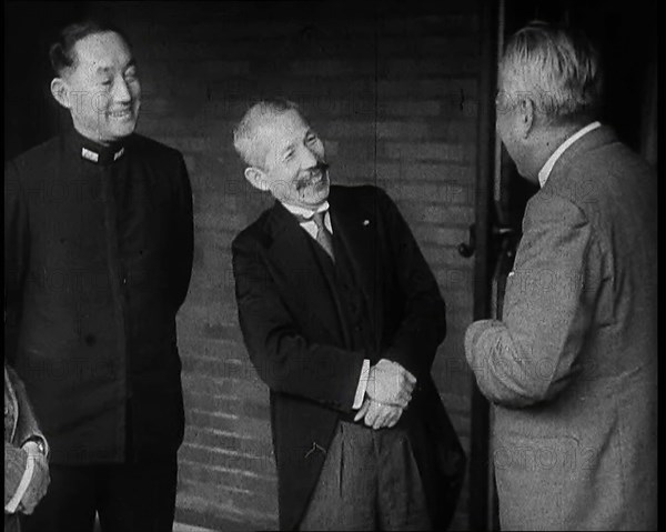 A Group of Four Male Japanese Politicians Talking Animatedly, 1937. Creator: British Pathe Ltd.