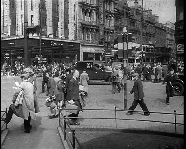 People and Traffic Moving Along Crowded Streets, 1940. Creator: British Pathe Ltd.