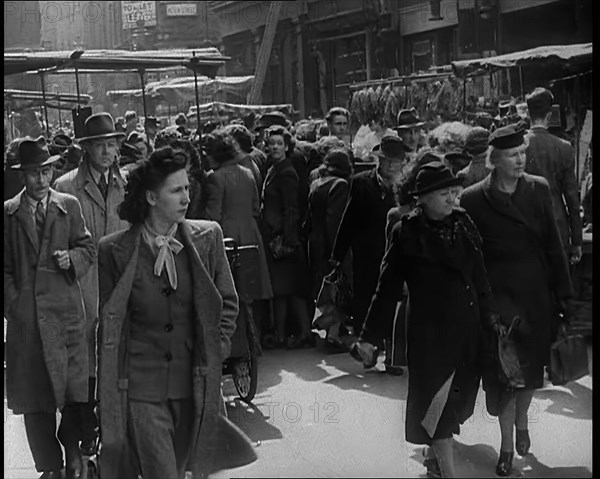 People Moving Along Crowded Streets, 1940. Creator: British Pathe Ltd.