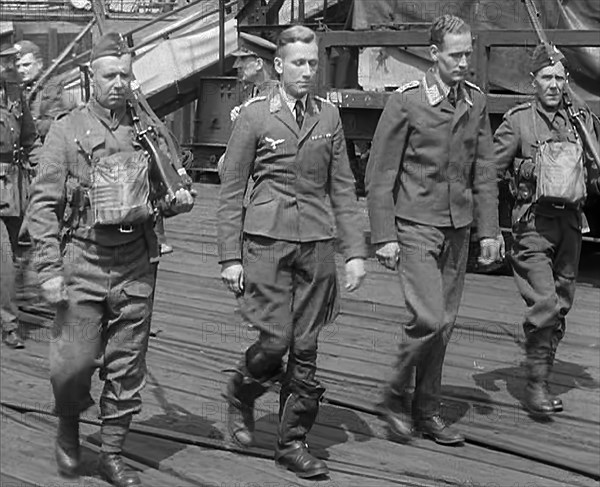 Two Captured German Pilots Being Escorted Away, 1940. Creator: British Pathe Ltd.