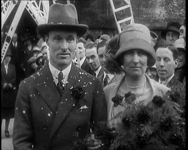 Male Civilian (Groom) And Female Civilian (Bride) Emerging from a Church To Walk Through an...,1927 Creator: British Pathe Ltd.