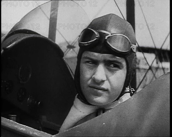 Bruno Mussolini, Son of Italian Leader Benito Mussolini, in Flying Cap Sitting in the..., 1937. Creator: British Pathe Ltd.