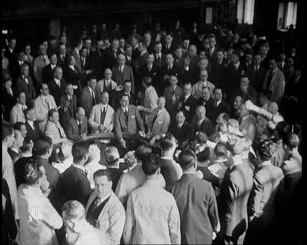 Crowd of Civilians Buying and Selling Stocks and Shares, 1932. Creator: British Pathe Ltd.