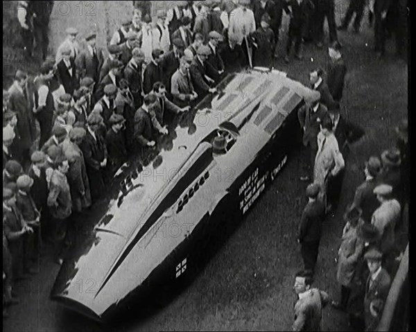 Sir Henry Segrave AKA Major Segrave's Car 'Sunbeam' Being Pushed By a Crowd of Civilians, 1927. Creator: British Pathe Ltd.