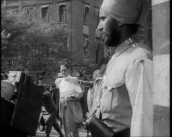 Indian Soldier in the International Settlement in Shanghai With Civilian..., 1937 Creator: British Pathe Ltd.