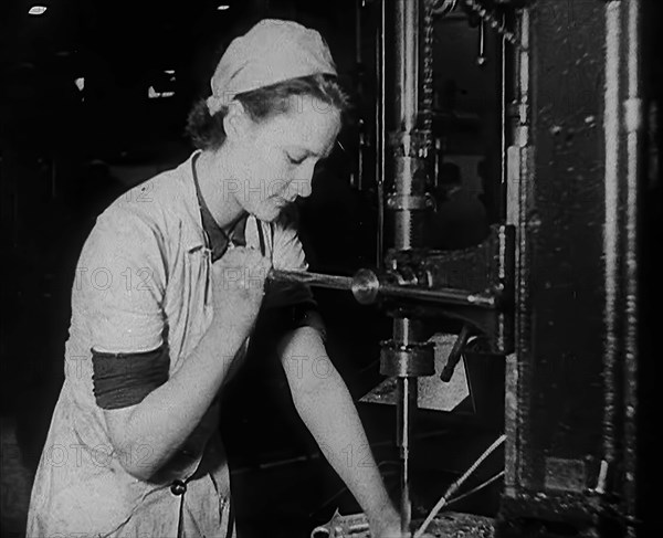 Woman Working in a Factory, 1940. Creator: British Pathe Ltd.