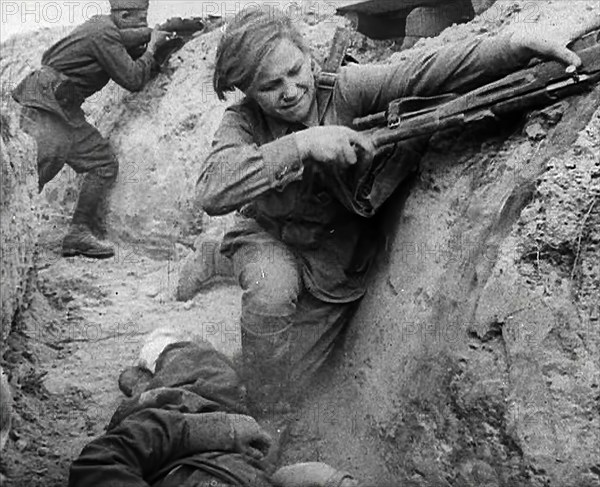 Two Russian Soldiers Taking Cover in a Trench, 1941. Creator: British Pathe Ltd.