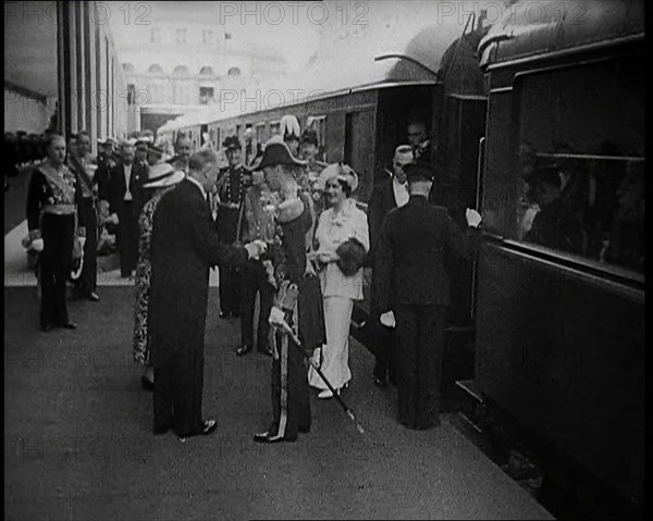 King George VI and Queen Elizabeth of Britain Being Greeted in Paris at Bois de Boulogne..., 1938. Creator: British Pathe Ltd.