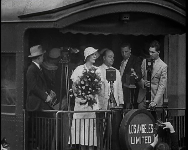 Aimee Semple McPherson Conducting a Crowd in Singing a Hymn, 1930s. Creator: British Pathe Ltd.