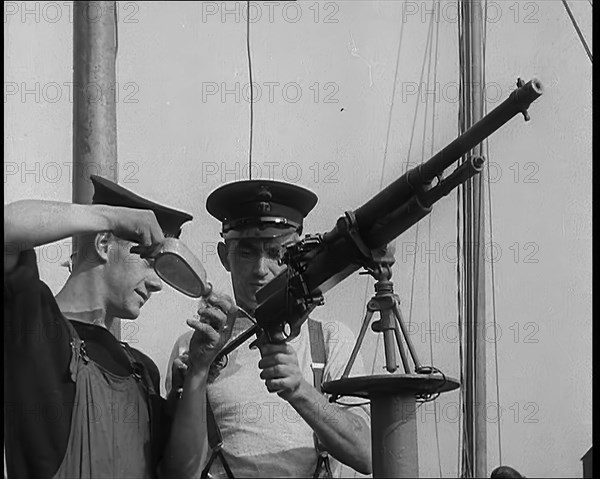 British Sailors Mounting Machine Guns To Small Boats for the Dunkirk Evacuation, 1940. Creator: British Pathe Ltd.