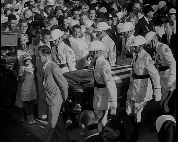 Male American Soldiers in White Uniforms Carrying the Coffin of Anton Cermak, the Mayor of..., 1933. Creator: British Pathe Ltd.