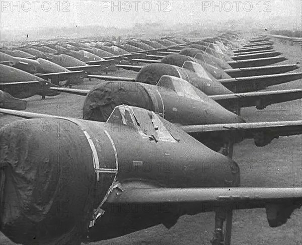 Warplanes Sitting in an Airfield With Covers Over the Propellers, 1943-1944. Creator: British Pathe Ltd.