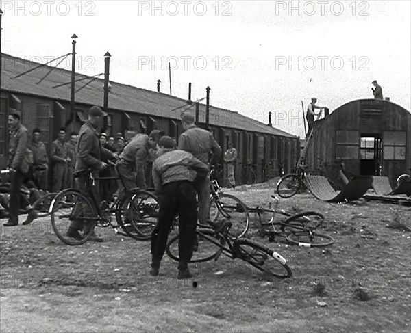 American Airmen Queueing up Outside a Building at an Airfield in England, 1943-1944. Creator: British Pathe Ltd.