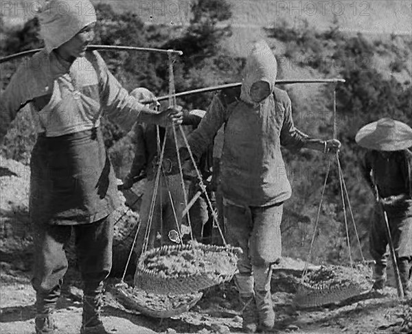 Civilians Carrying Supplies Along the Ledo or  Burma Road, 1943. Creator: British Pathe Ltd.