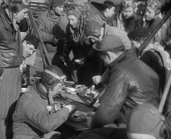 American Airmen Sitting and Eating in an Airfield, 1943-1944. Creator: British Pathe Ltd.