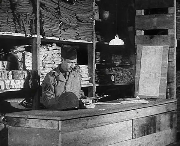 An American Store Keeper Logging Stocks of Supplies at a Storage Facility in an..., 1943-1944. Creator: British Pathe Ltd.